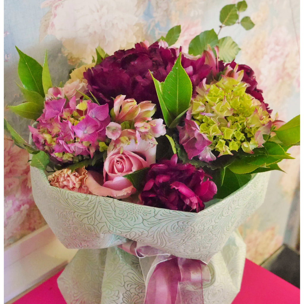 Modern Xmas Colour mix.  Cerise, lime hot pink and mid purples. In a waterbox with mint green wrap